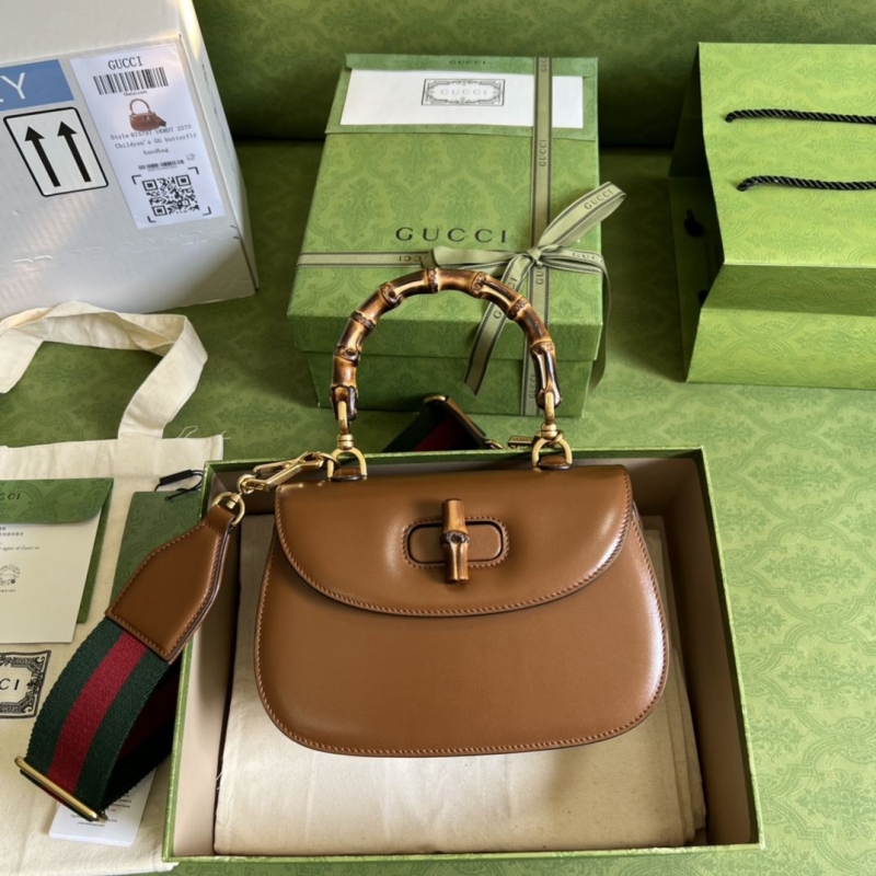 G*u*i top handle bags